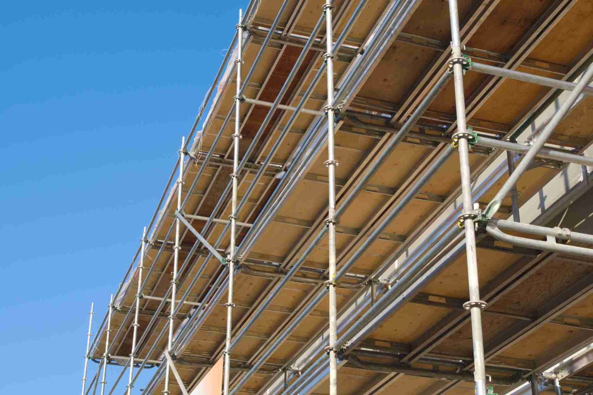 Construction scaffolding under a blue sky